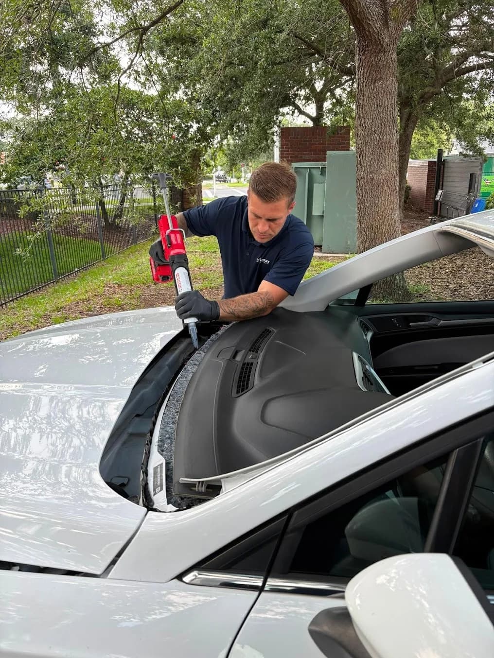 Starplex technician installing a windshield at a customer's location